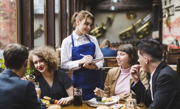 waitress-taking-orders-from-people-restaurant_23-2148006738